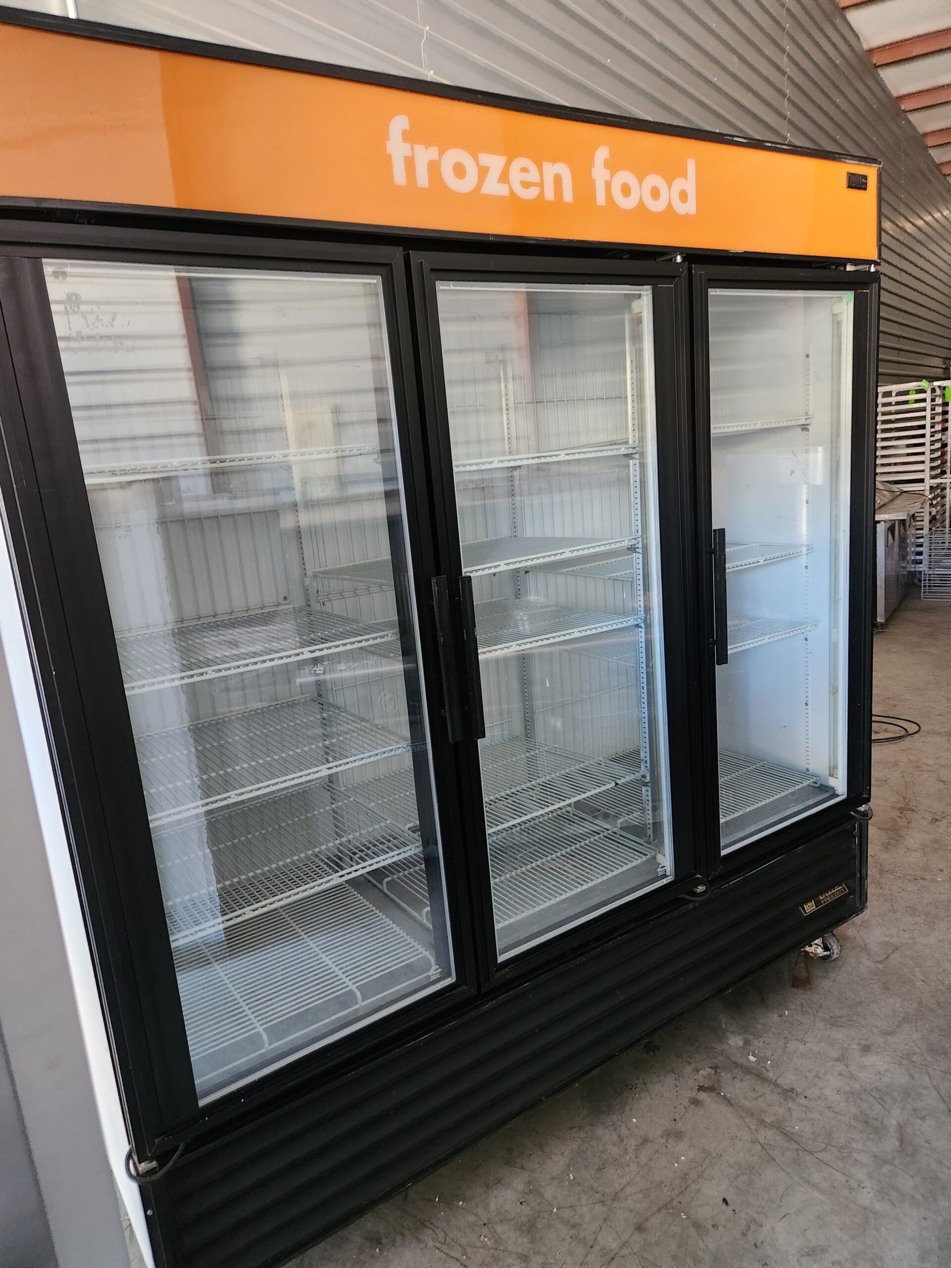 TRUE 3 GLASS DOORS FREEZER WITH CASTERS Used Equipment